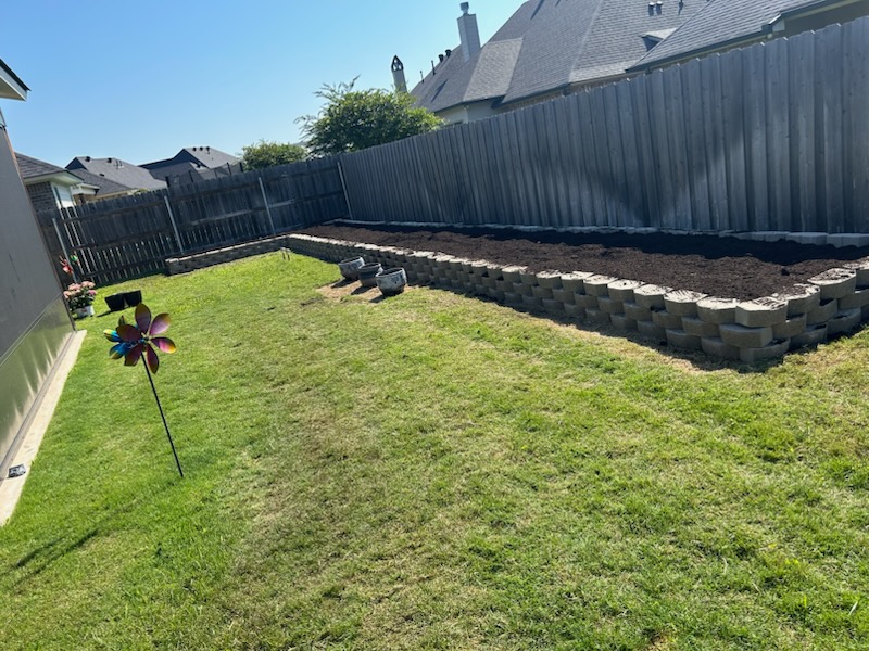 Stone garden path with landscaped flower beds